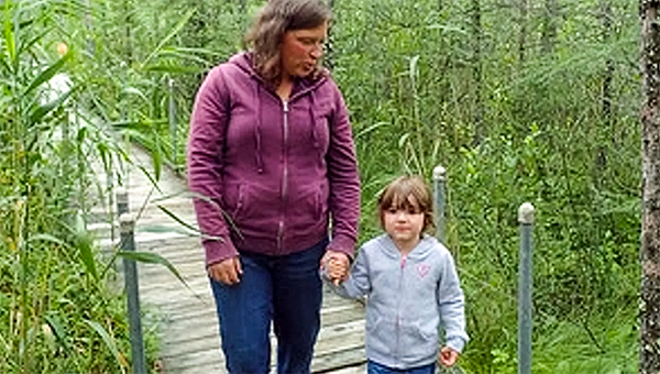 mother and child walking a trail in the bemidji area
